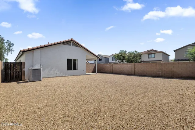 a view of outdoor space with wooden fence