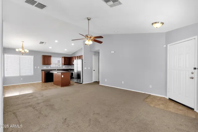 a view of a kitchen with a stove cabinets