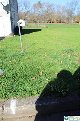 a view of yard with swimming pool