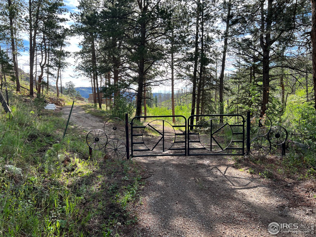 2880 Fire Rte 15 Bellvue, CO 80512 - Photo 13 of 40 Key Locked Gate at beginning of the Property