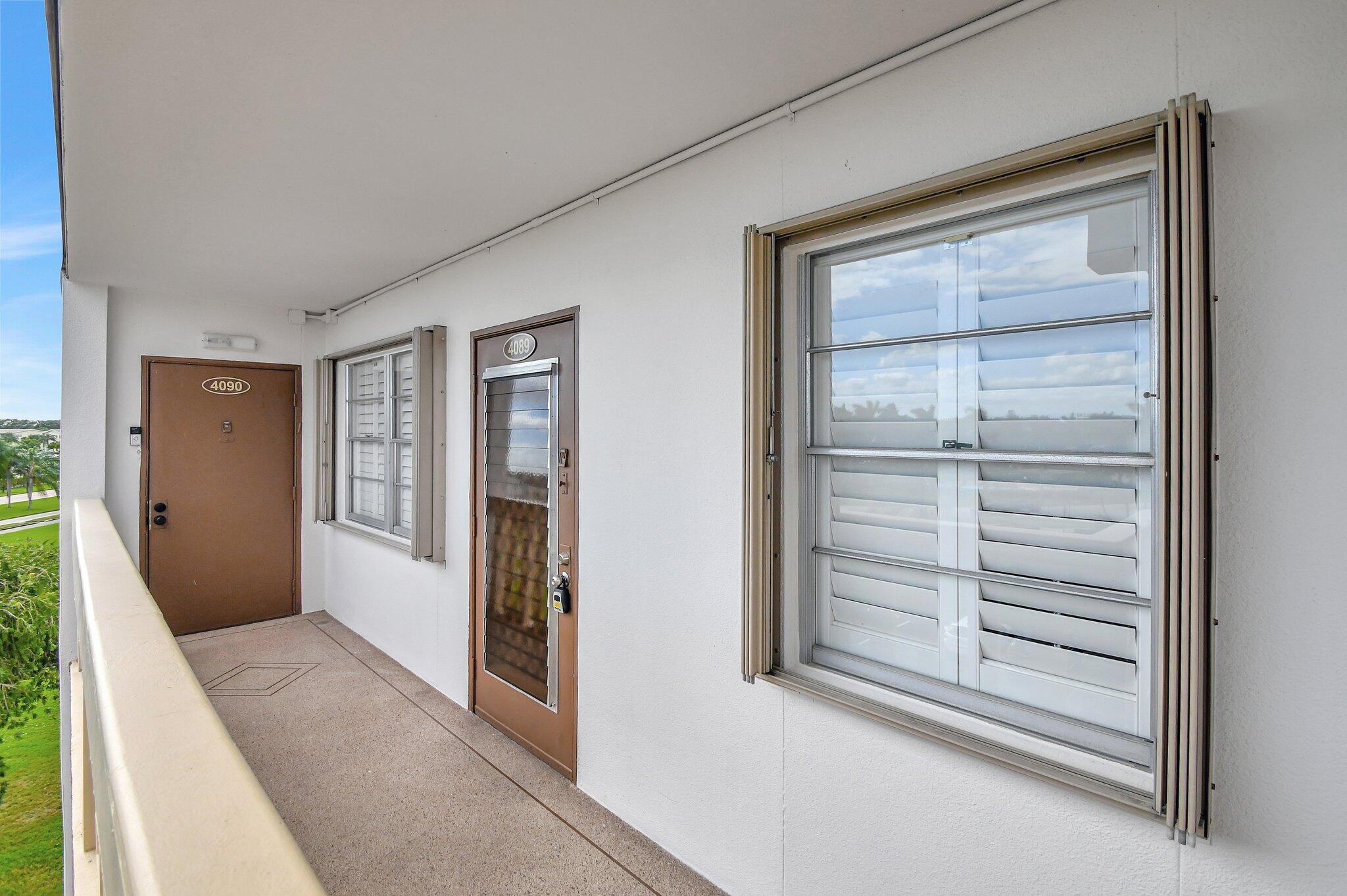 4089 Guildford East, Unit E Boca Raton, FL 33434 - Photo 21 of 22 a view of an empty room and window