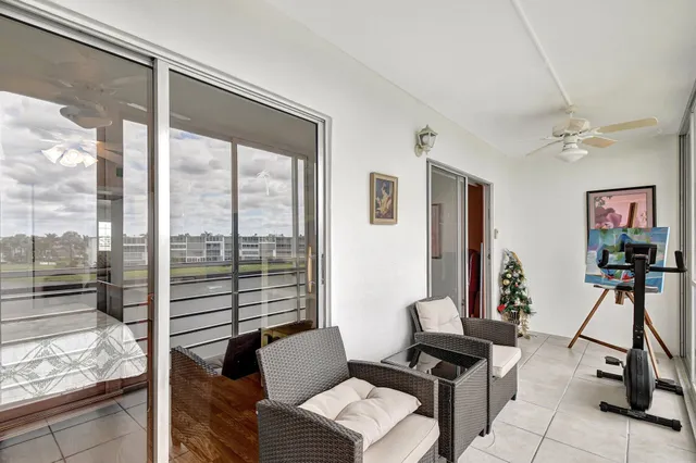 a view of a livingroom with furniture and windows