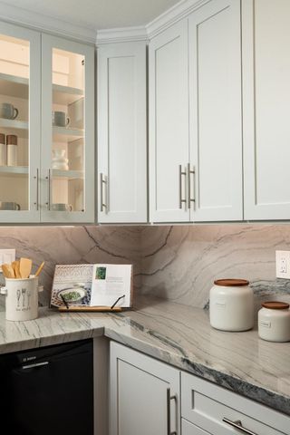 a kitchen with a sink and cabinets