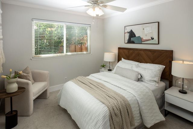 a bedroom with bed and a window