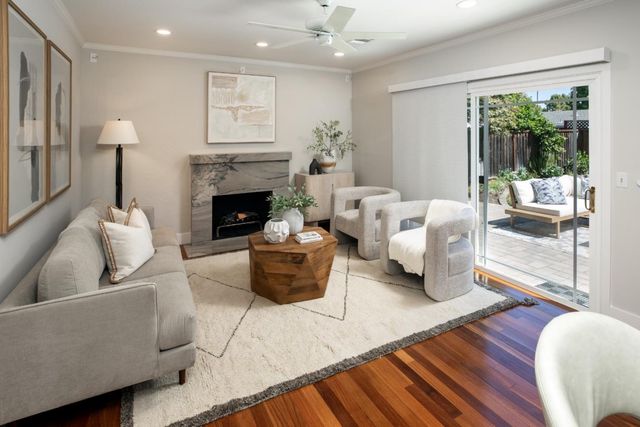 a living room with furniture and a fireplace