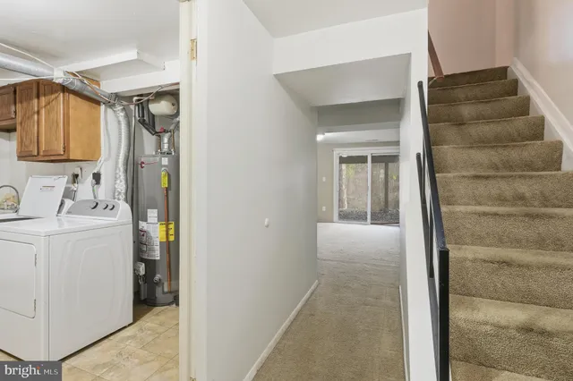 a view of hallway with washer and dryer