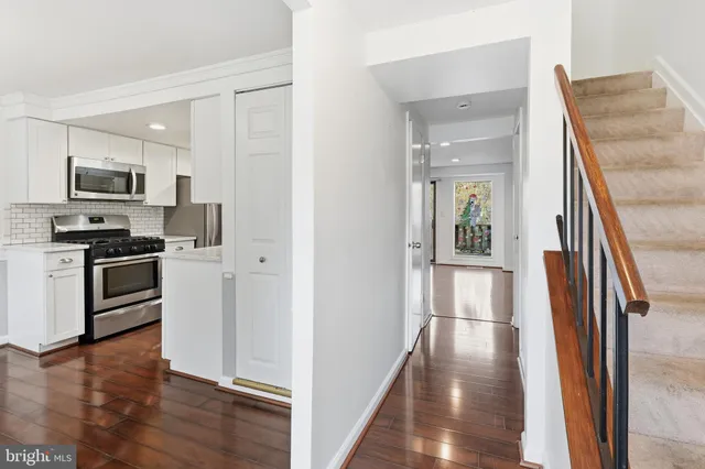 a freezer and a stove sitting inside of a kitchen