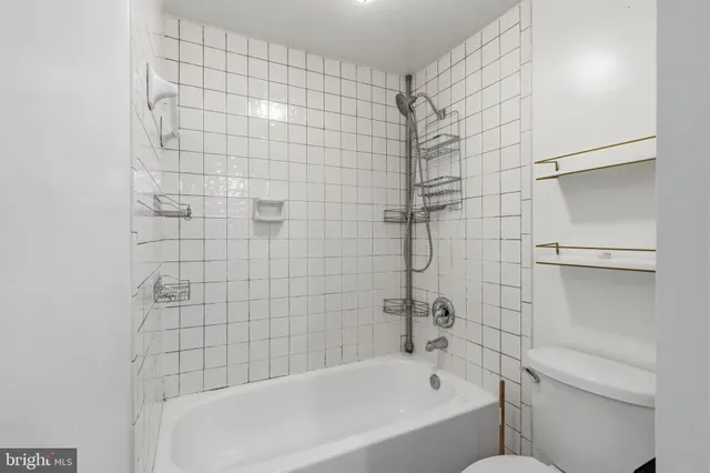 a bathroom with a bathtub and shower