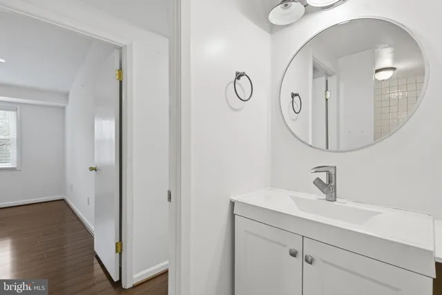 a bathroom with a sink and mirror
