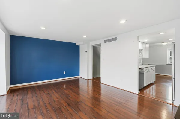a view of a kitchen with wooden floor