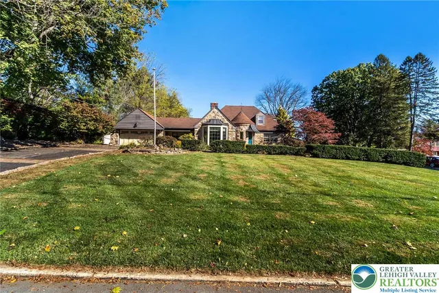 a view of a town with large trees