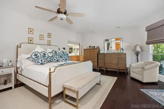 a bedroom with a bed and a couch