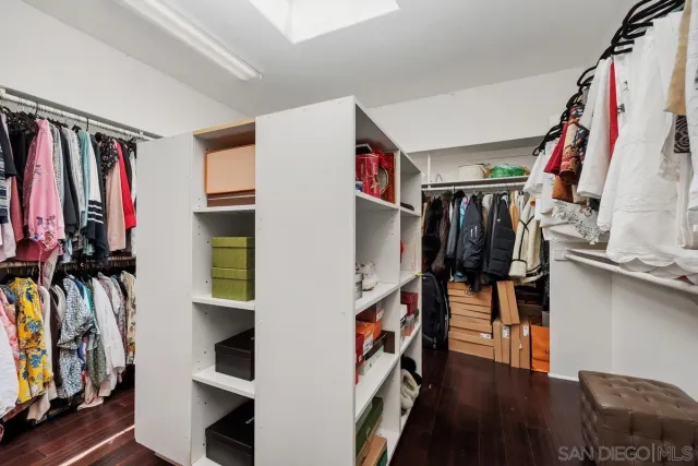 a bedroom with a bed and a chair