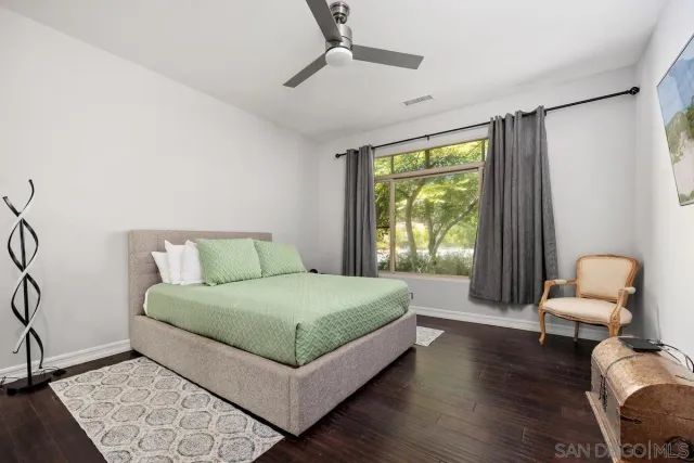 a bedroom with a bed and chair