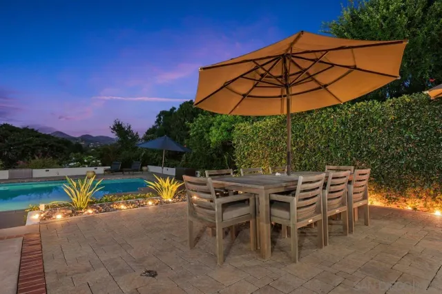 a view of a swimming pool with a patio