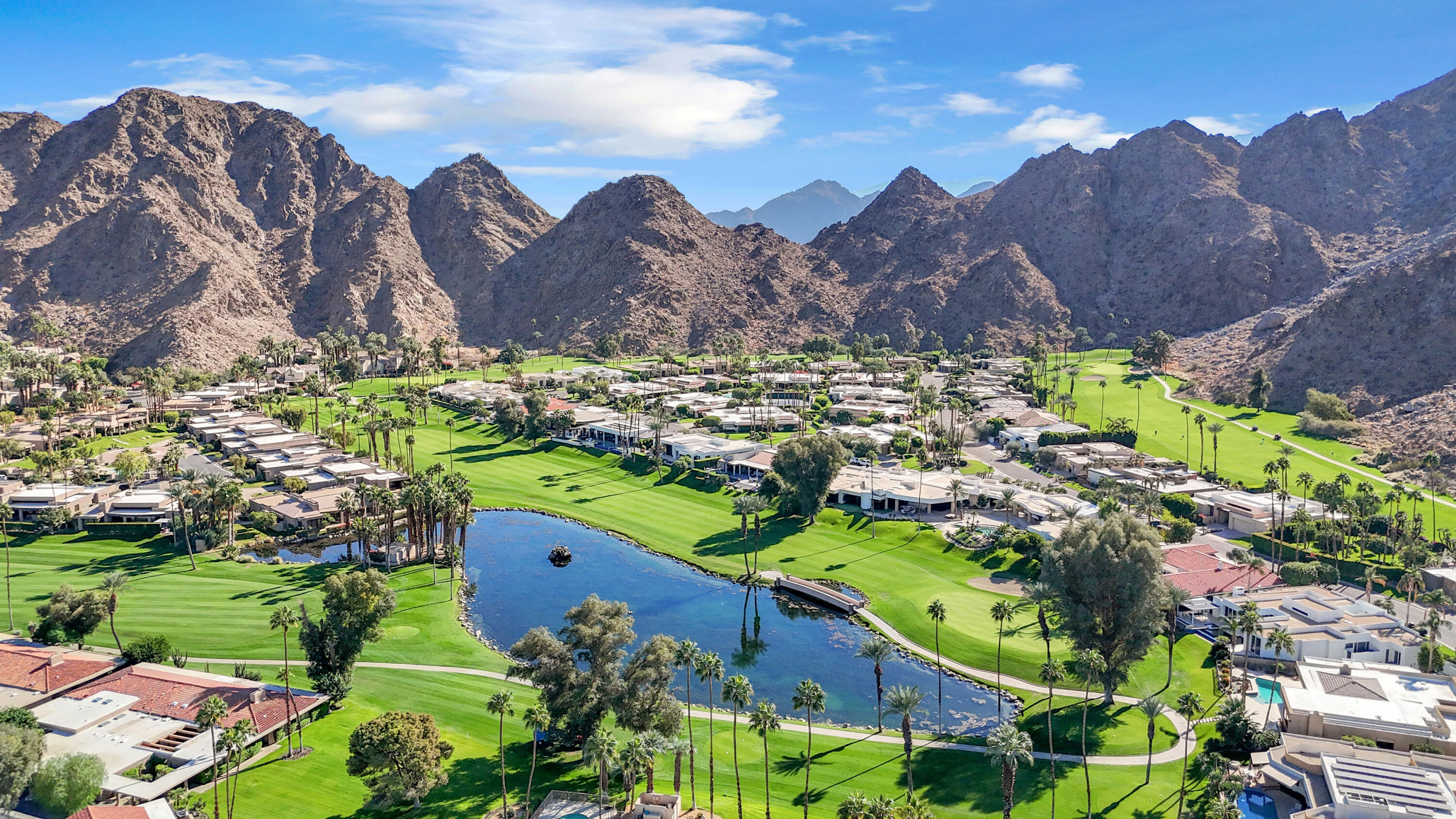 a view of a garden with a building in the background