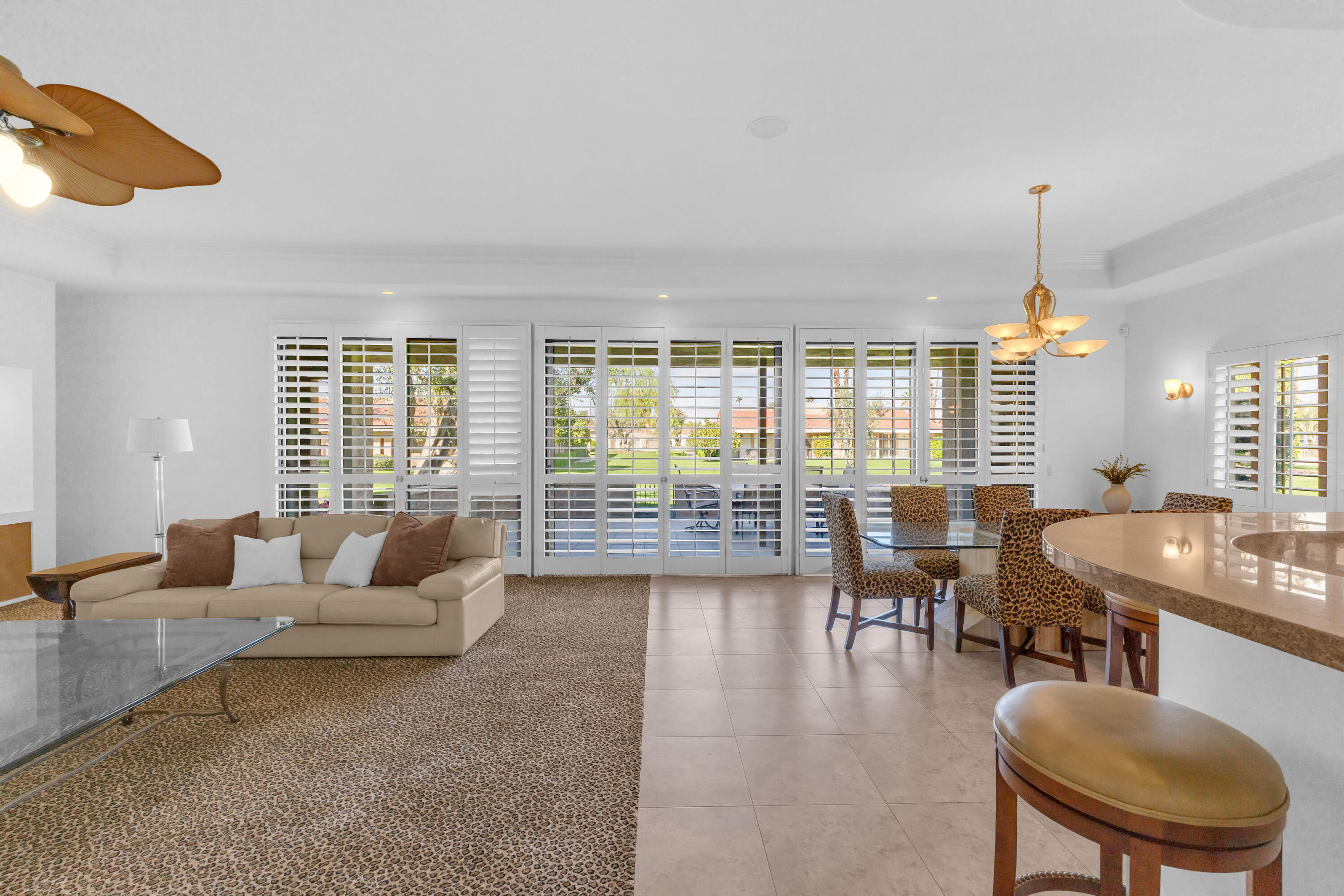 77690 Seminole Road Indian Wells, CA 92210 - Photo 25 of 59 a living room with furniture and a large window