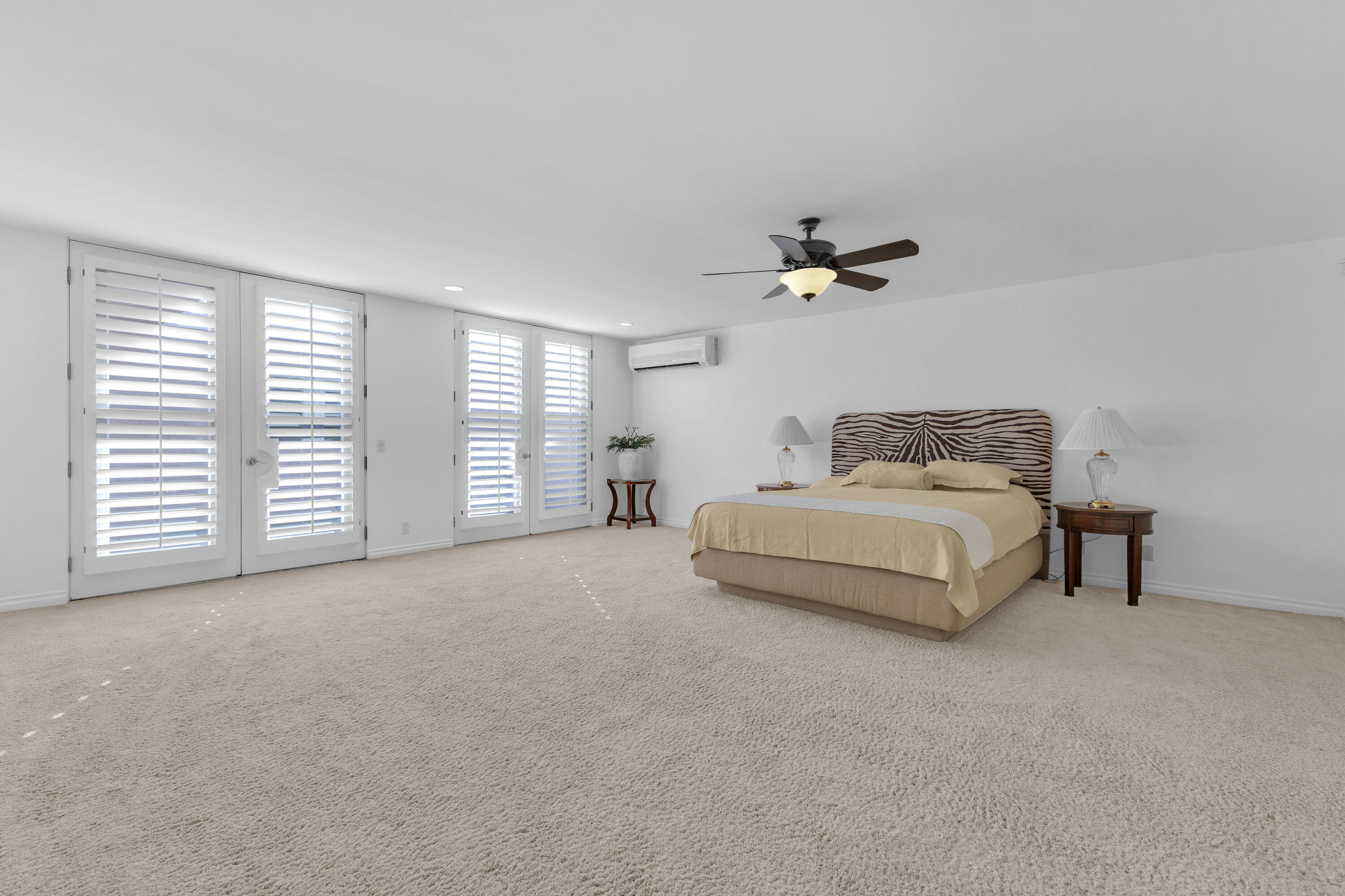 77690 Seminole Road Indian Wells, CA 92210 - Photo 35 of 59 a bedroom with furniture and a ceiling fan