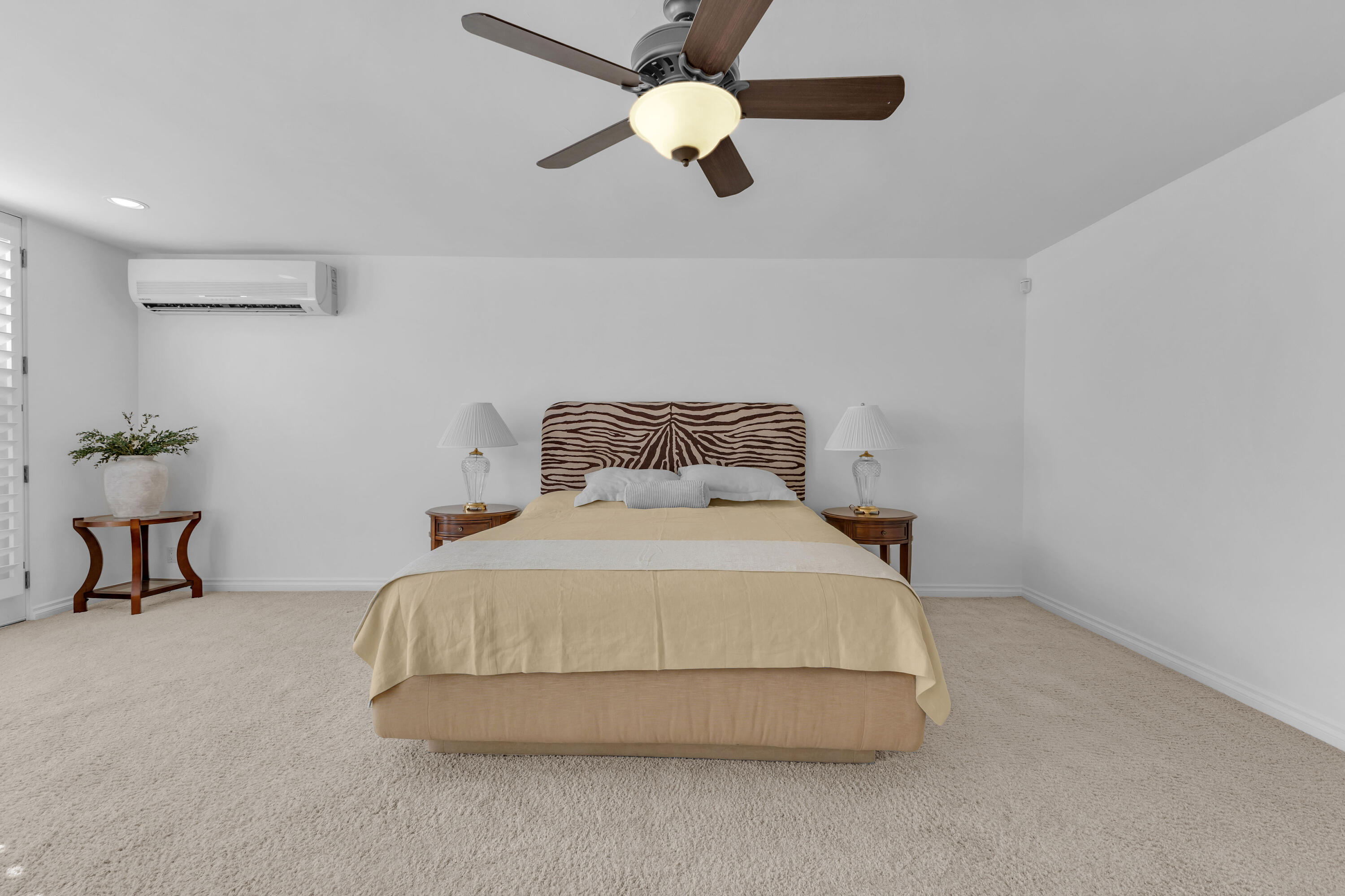 77690 Seminole Road Indian Wells, CA 92210 - Photo 36 of 59 a bedroom with a bed and a chandelier