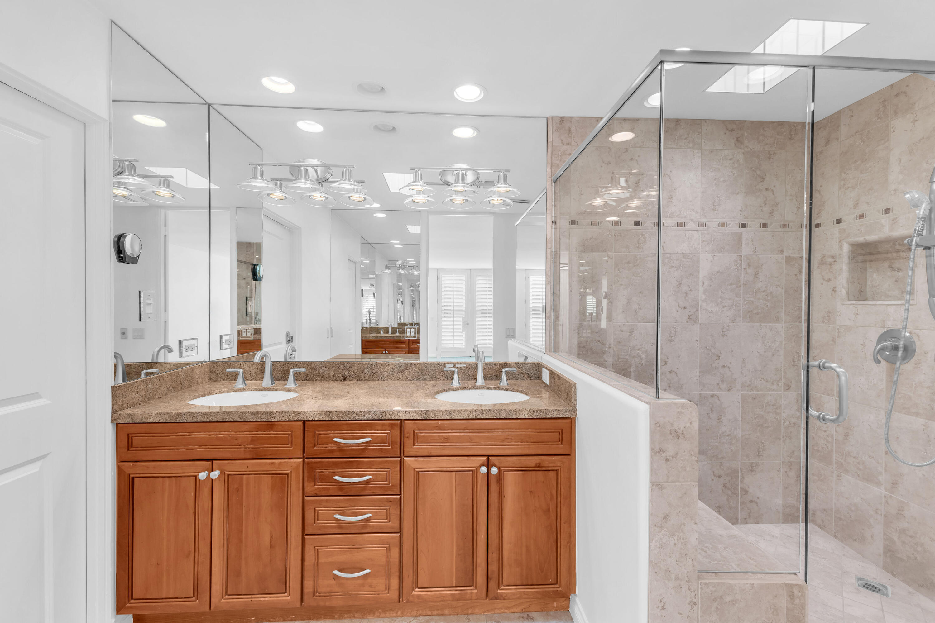 77690 Seminole Road Indian Wells, CA 92210 - Photo 39 of 59 a bathroom with a granite countertop sink mirror and double