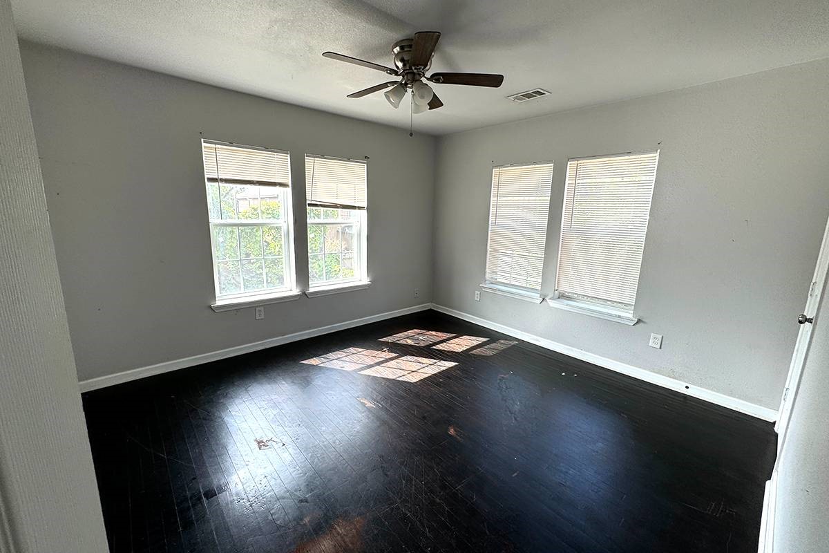 3420 Rosedale Street Houston, TX 77004 - Photo 16 of 19 a view of empty room with wooden floor and fan