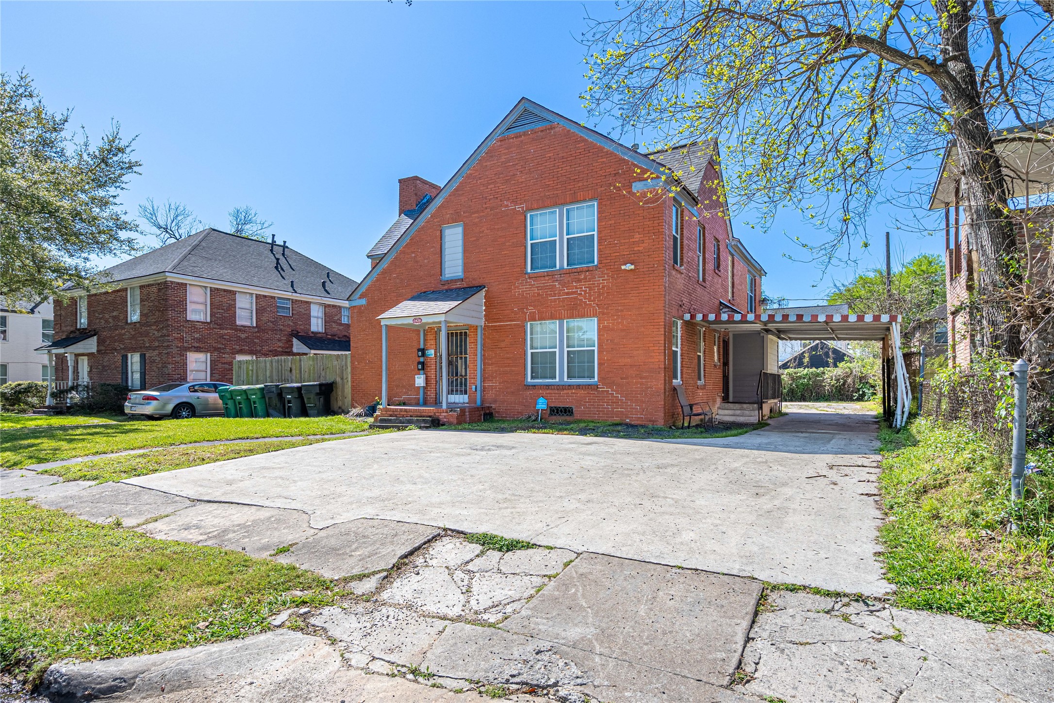 3420 Rosedale Street Houston, TX 77004 - Photo 2 of 11 a front view of a house with a yard and garage