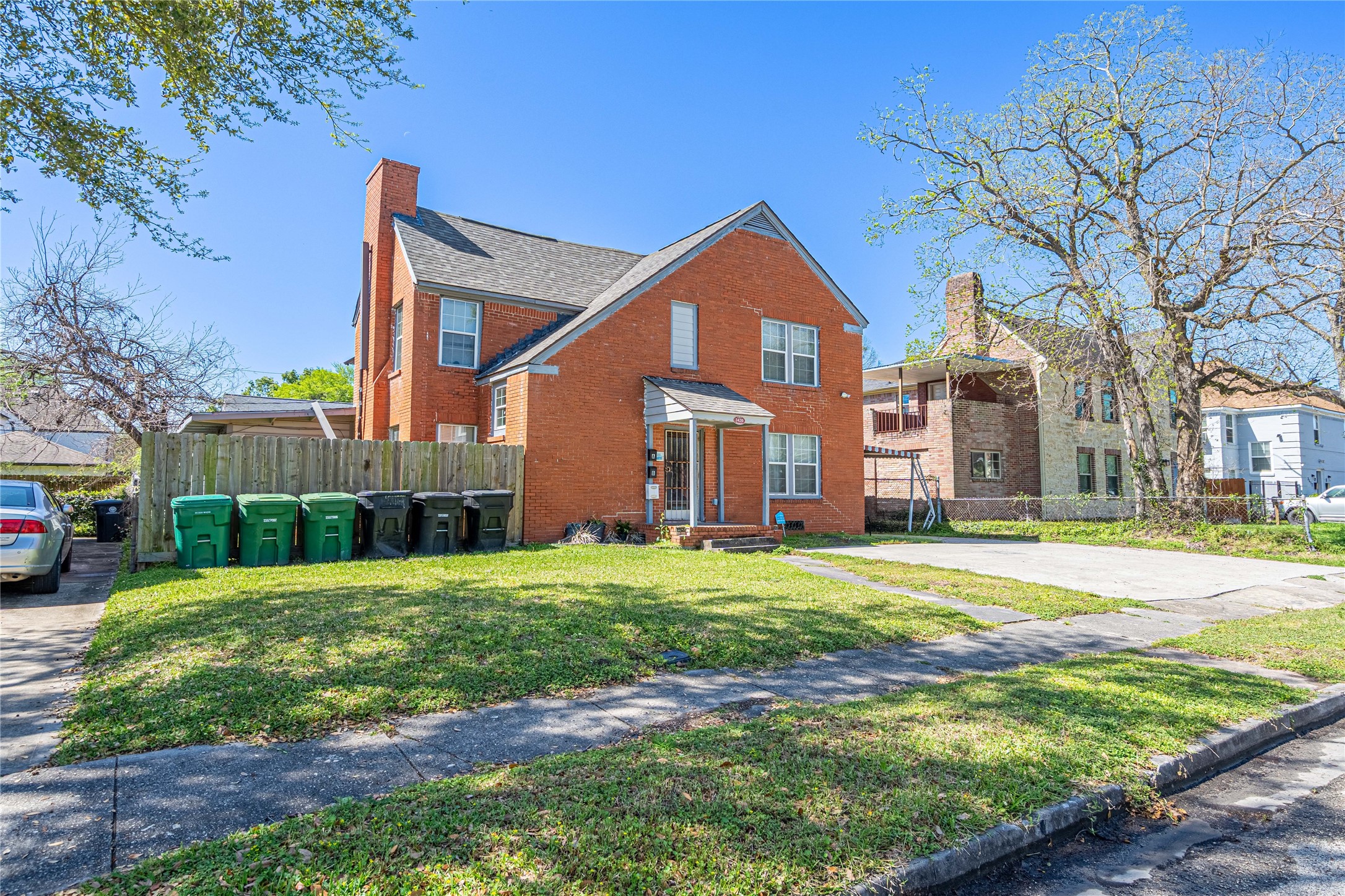 3420 Rosedale Street Houston, TX 77004 - Photo 3 of 11 a front view of a house with a yard and garage