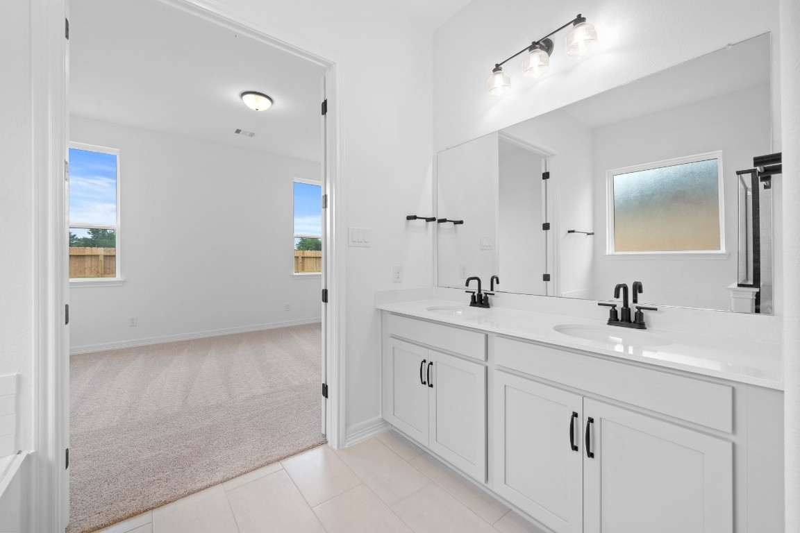 32107 Waterlily View Hockley, TX 77447 - Photo 11 of 21 a spacious bathroom with double sink a mirror and a shower