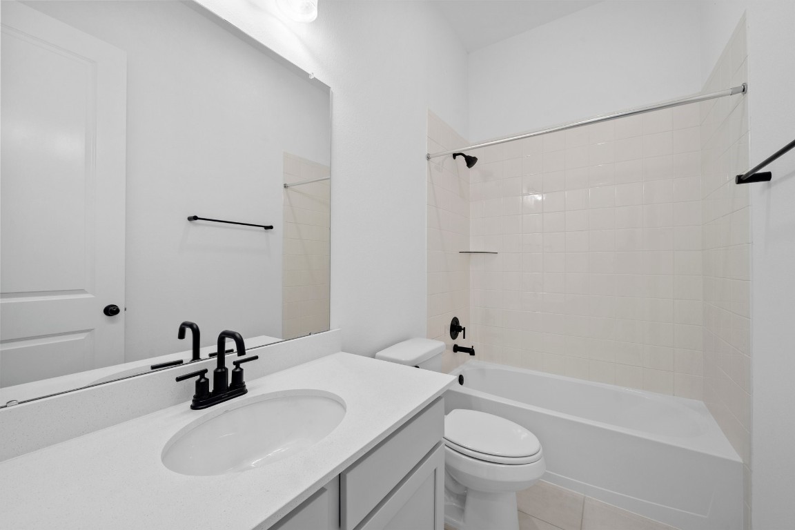 32107 Waterlily View Hockley, TX 77447 - Photo 14 of 21 a bathroom with a sink a toilet and shower