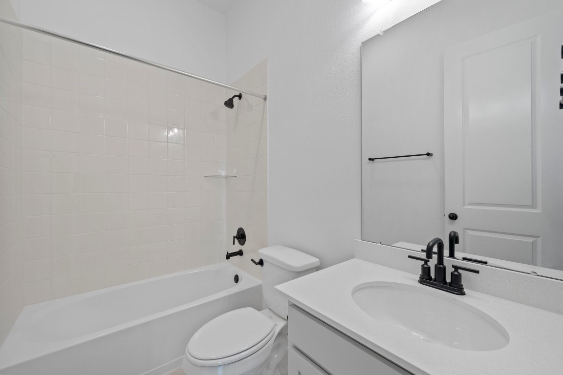 32107 Waterlily View Hockley, TX 77447 - Photo 16 of 21 a bathroom with a sink toilet and shower