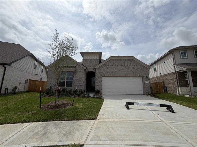 32107 Waterlily View Hockley, TX 77447 - Photo 21 of 21 a front view of a house with garden