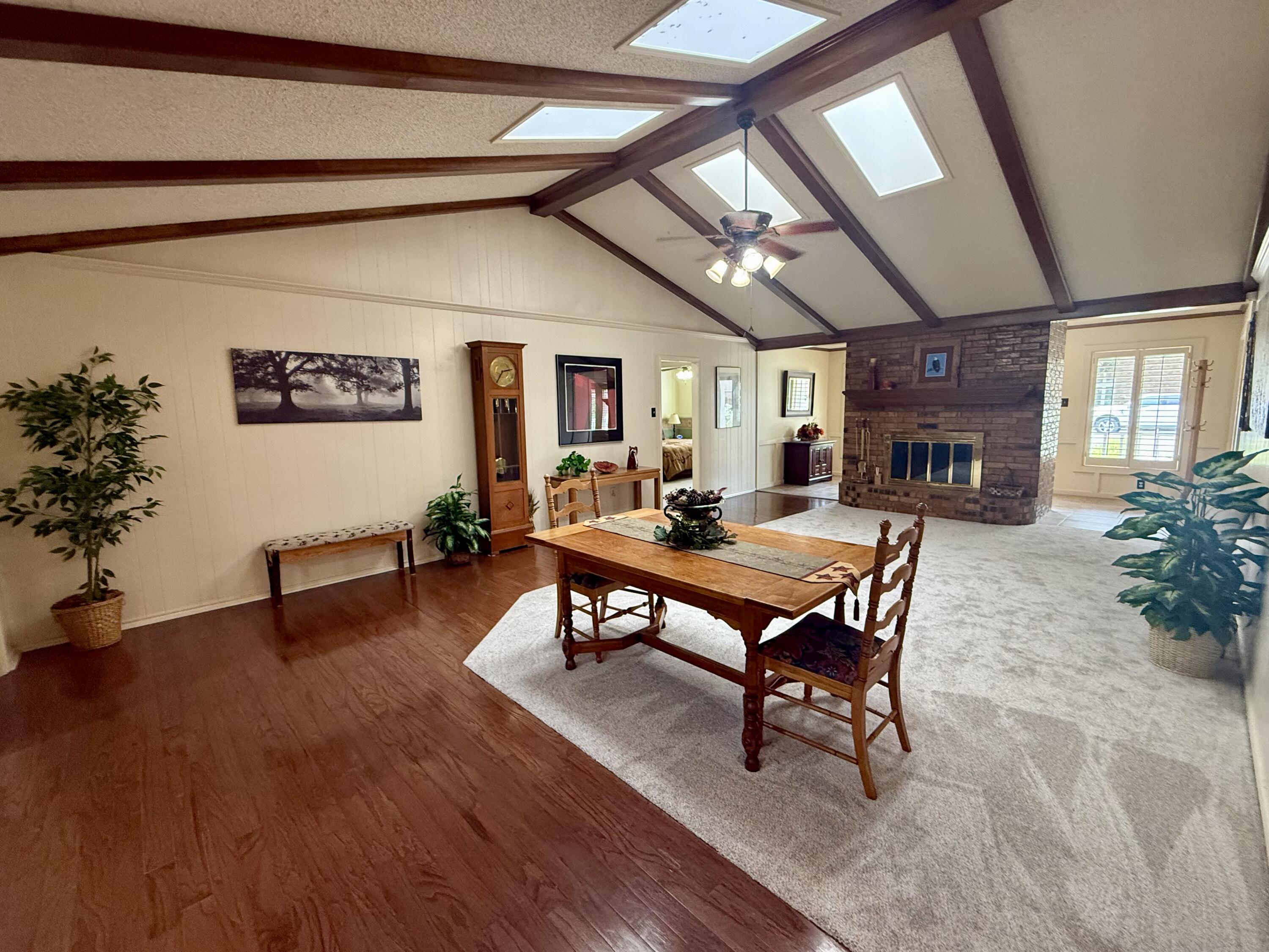 4911 92nd Street Lubbock, TX 79424 - Photo 11 of 77 a view of a dining room with furniture window and wooden floor
