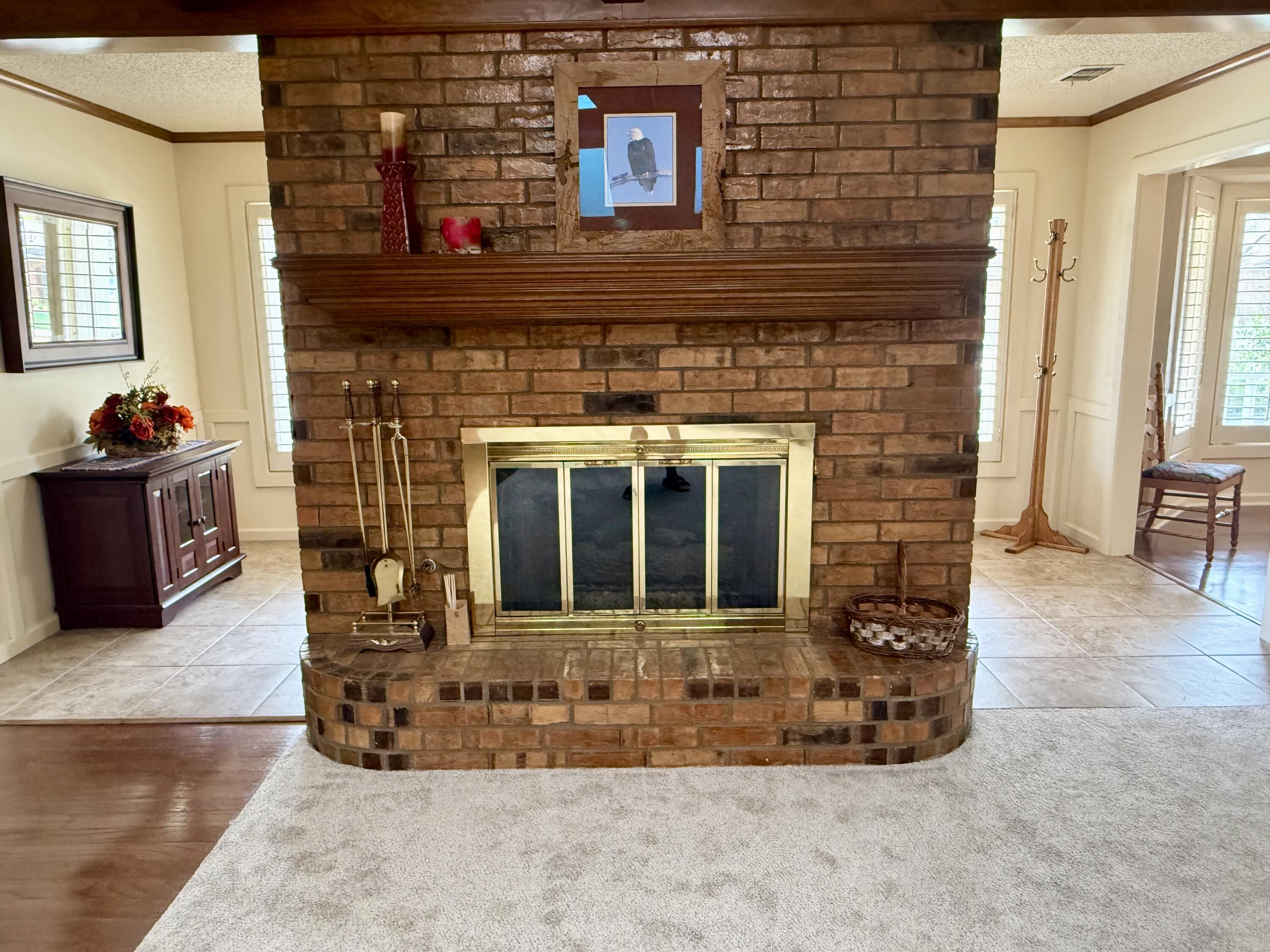 4911 92nd Street Lubbock, TX 79424 - Photo 13 of 77 a living room with furniture window and a fireplace