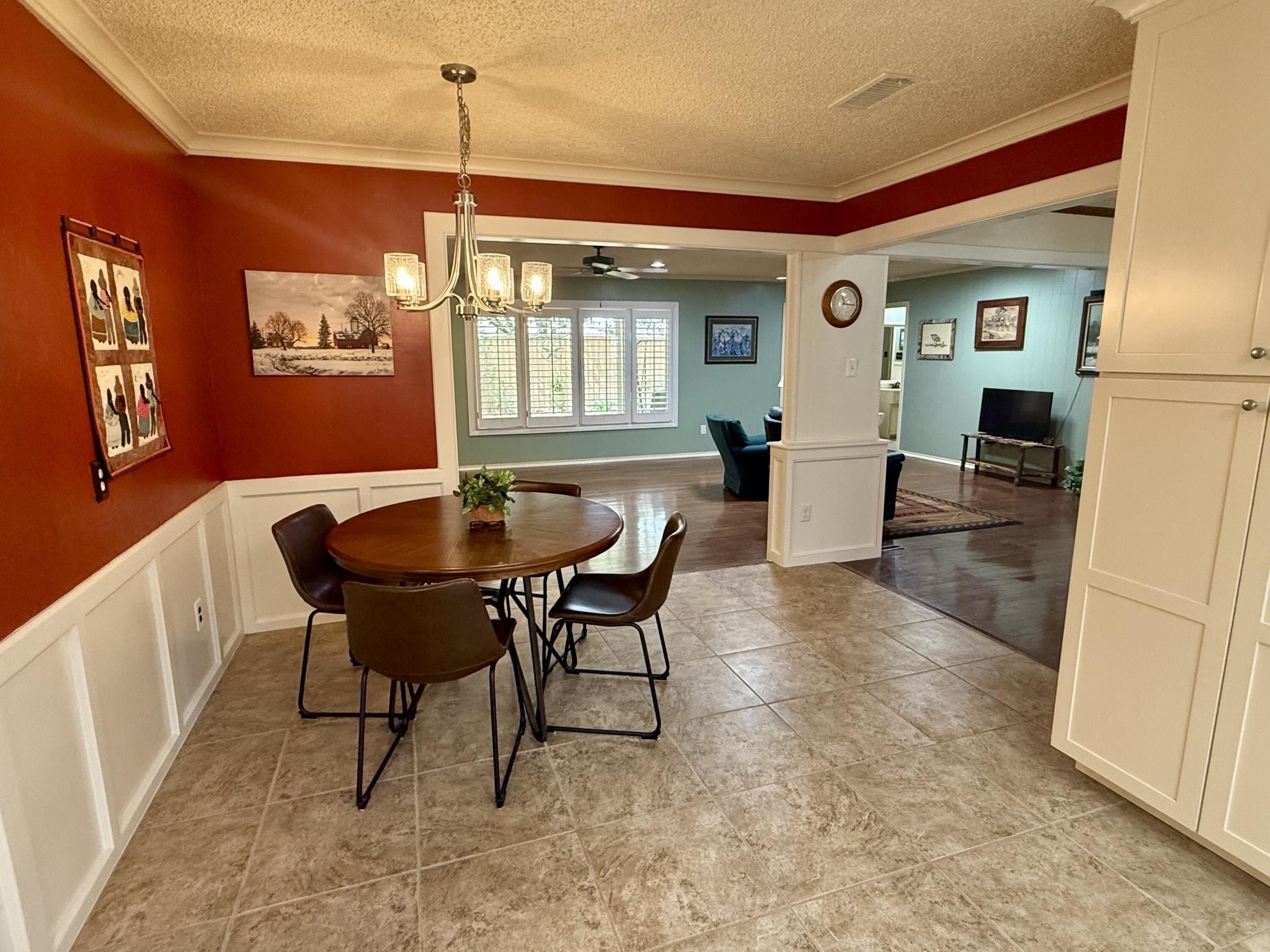 4911 92nd Street Lubbock, TX 79424 - Photo 29 of 77 a dining room with furniture and window
