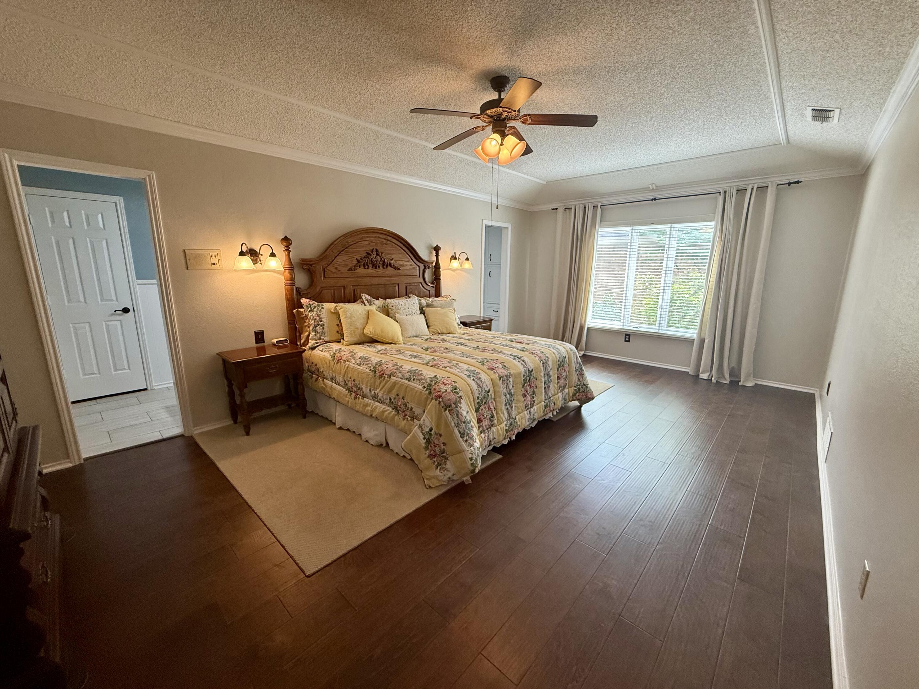 4911 92nd Street Lubbock, TX 79424 - Photo 40 of 77 a bedroom with a bed and a window