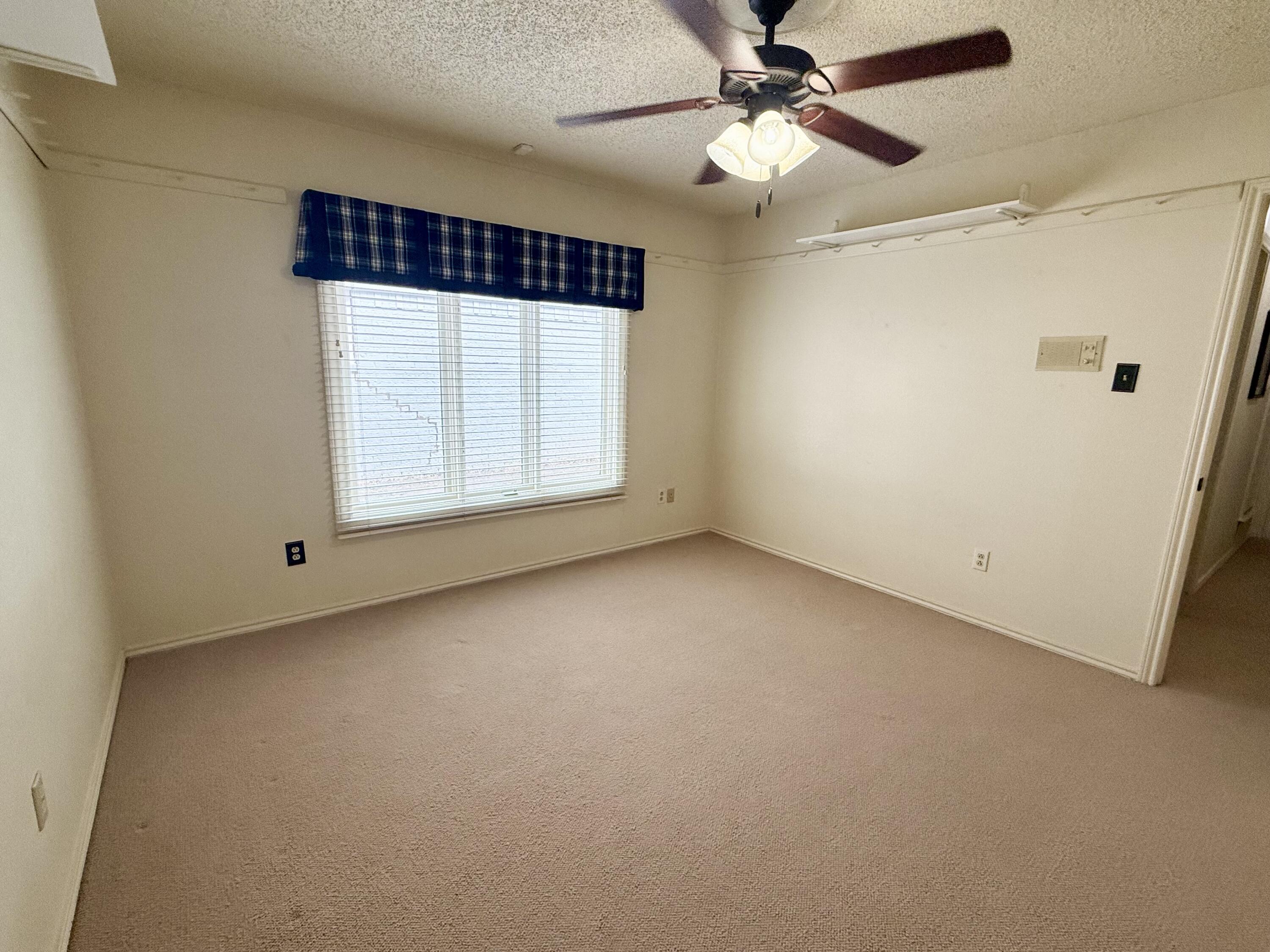 4911 92nd Street Lubbock, TX 79424 - Photo 62 of 77 a view of an empty room with a window