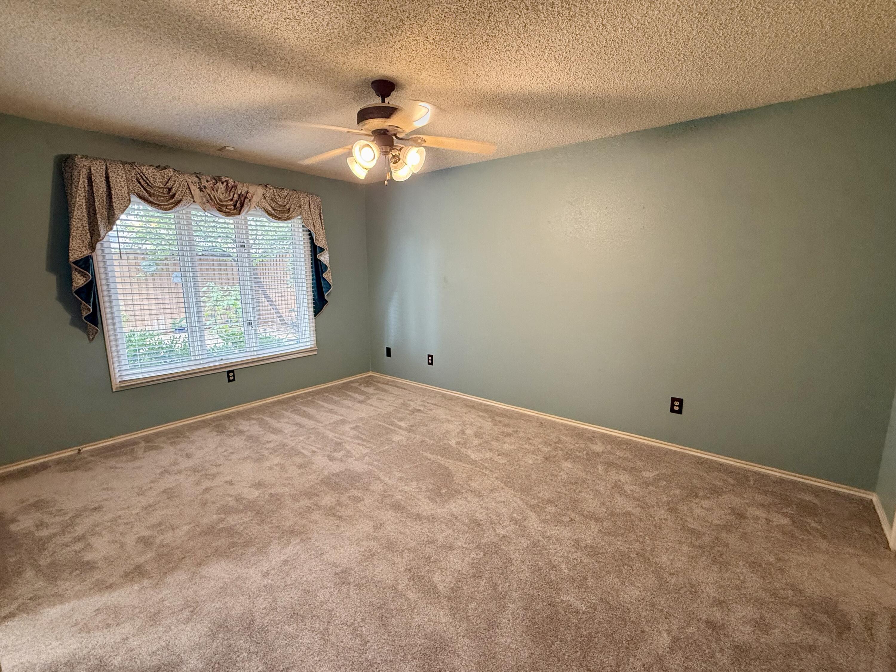 4911 92nd Street Lubbock, TX 79424 - Photo 65 of 77 a view of an empty room with a window