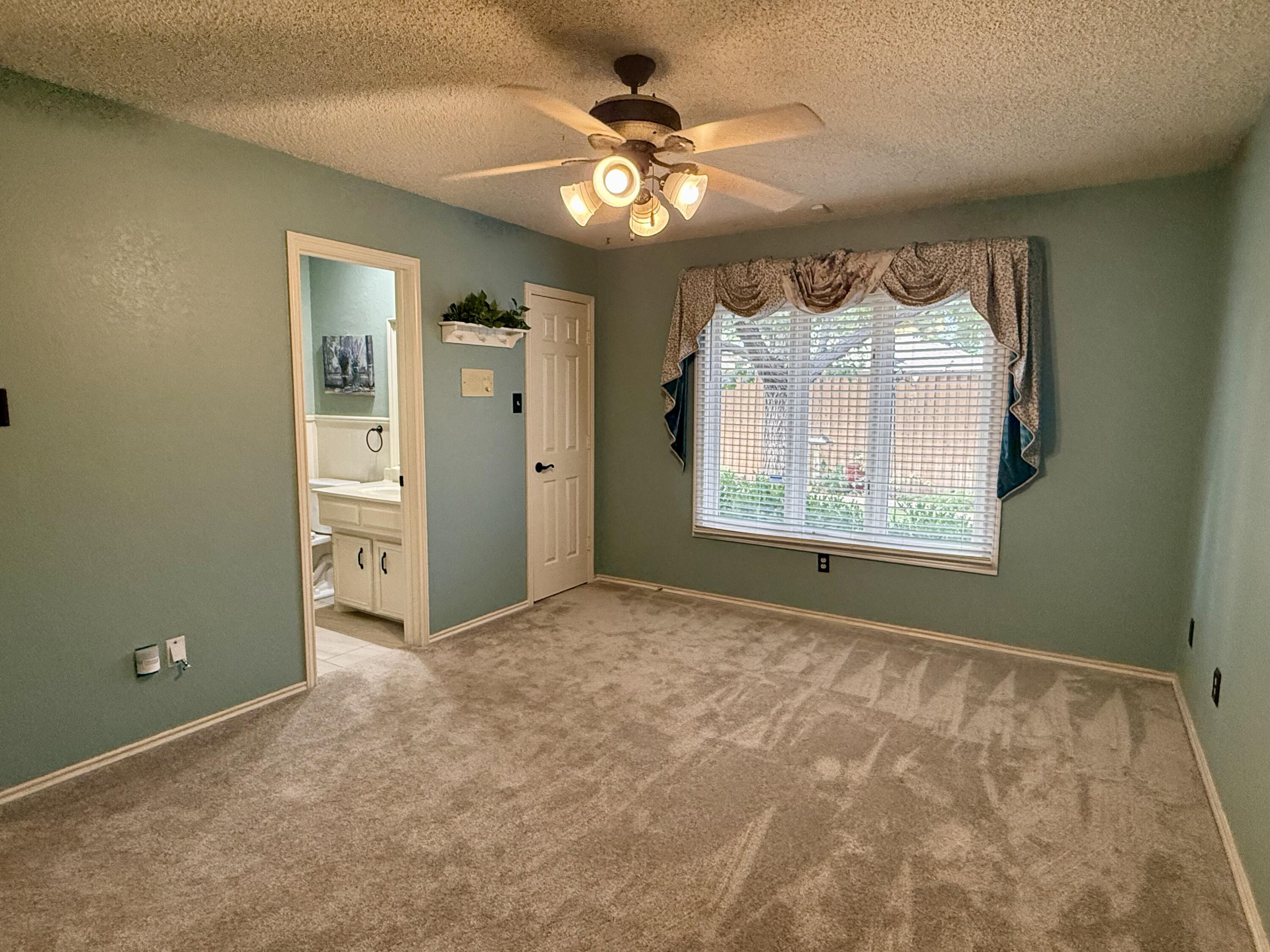 4911 92nd Street Lubbock, TX 79424 - Photo 66 of 77 a view of an empty room and a window