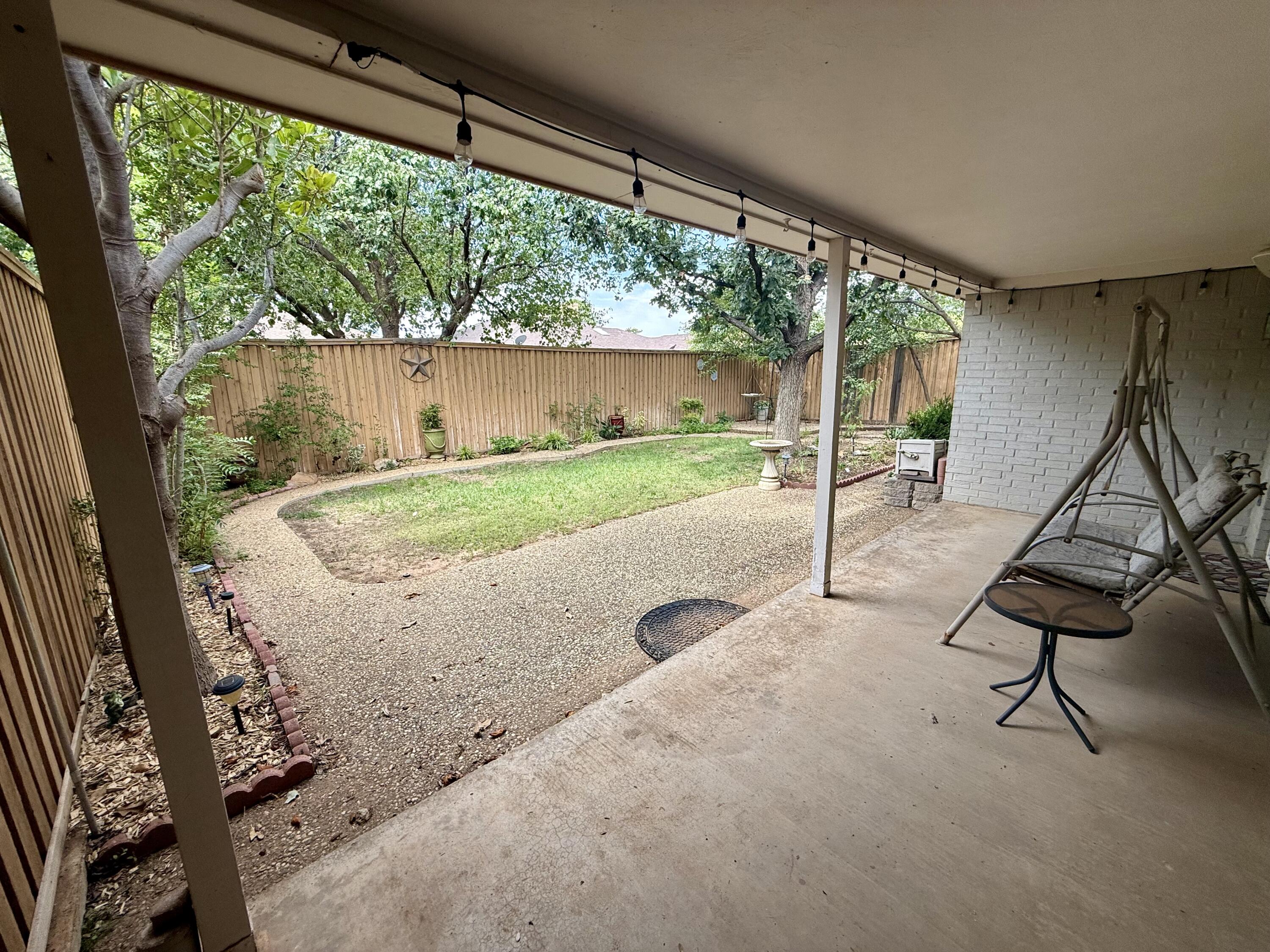 4911 92nd Street Lubbock, TX 79424 - Photo 70 of 77 a view of a room with porch and wooden floor