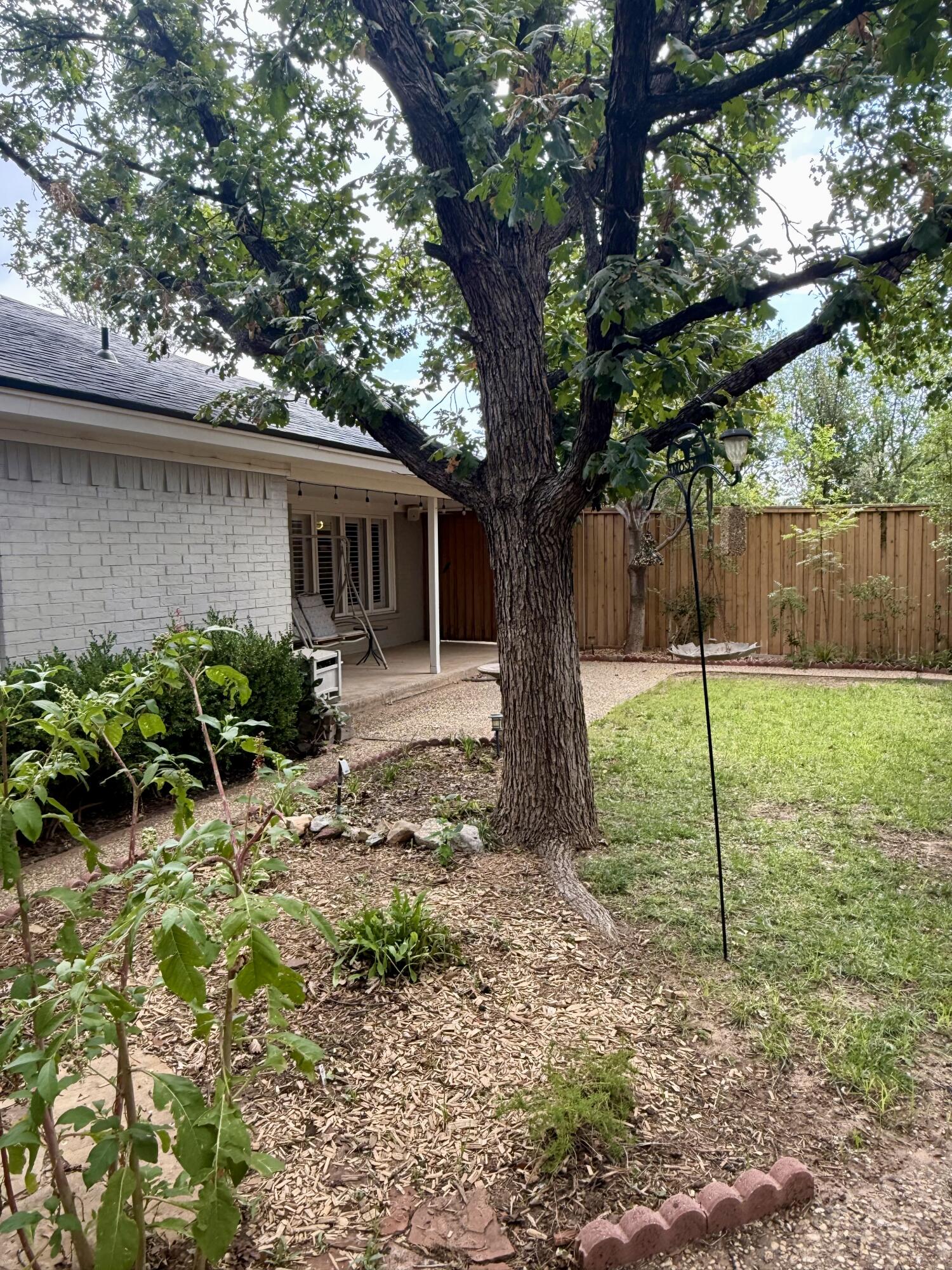 4911 92nd Street Lubbock, TX 79424 - Photo 74 of 77 a house view with a garden space