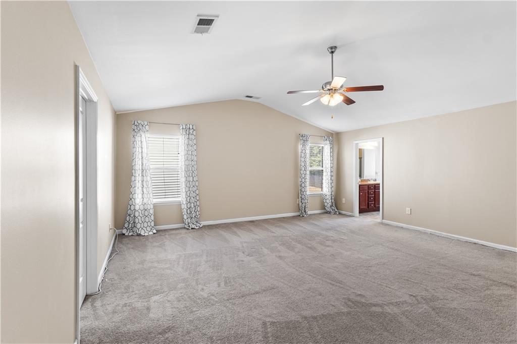 9116 Alden Drive Locust Grove, GA 30248 - Photo 17 of 27 wooden floor in an empty room with a window