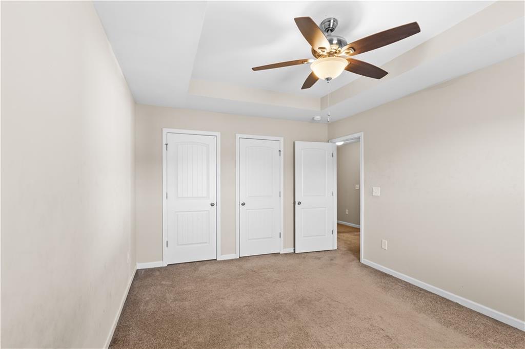 9116 Alden Drive Locust Grove, GA 30248 - Photo 21 of 27 an empty room with ceiling fan and window