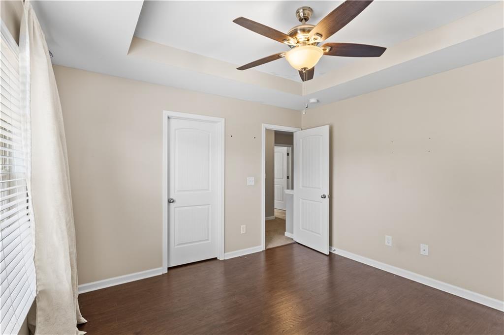 9116 Alden Drive Locust Grove, GA 30248 - Photo 24 of 27 wooden floor in an empty room with a window