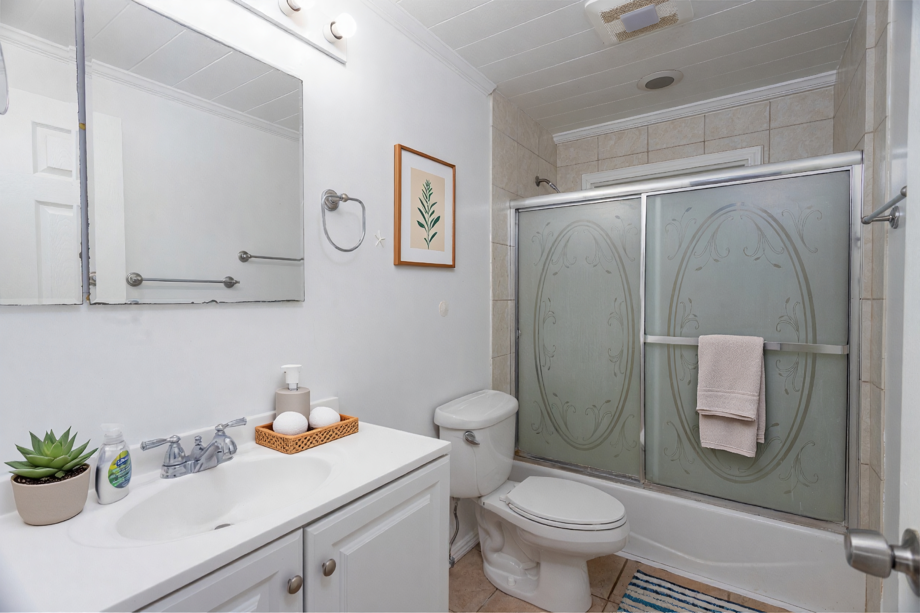 4580 Mamane Street Kapaa, HI 96746 - Photo 16 of 30 a bathroom with a sink a toilet and shower