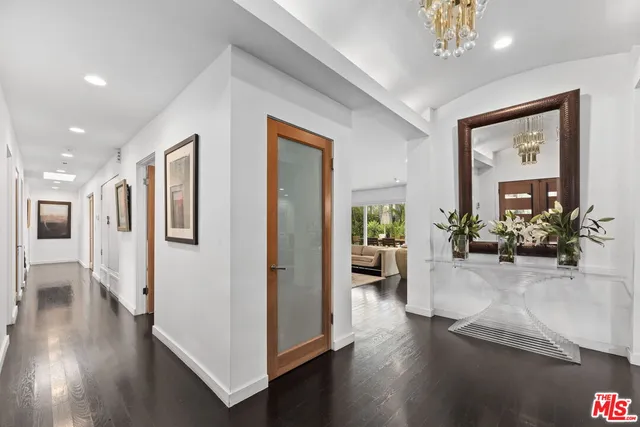 a bedroom with a large bed and a large window