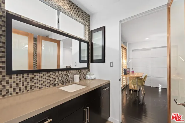 a front view of a house with swimming pool having outdoor seating