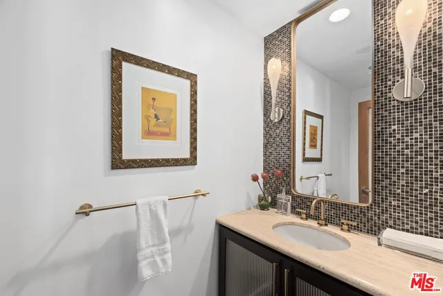 a view of a patio with couches table and chairs and potted plants