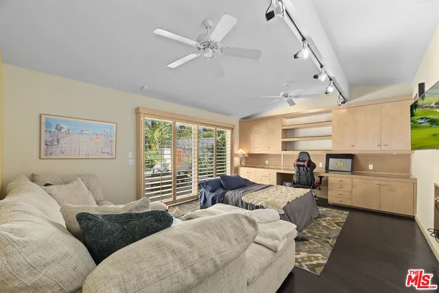 an aerial view of a residential houses with yard