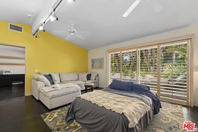 an aerial view of residential houses with city view