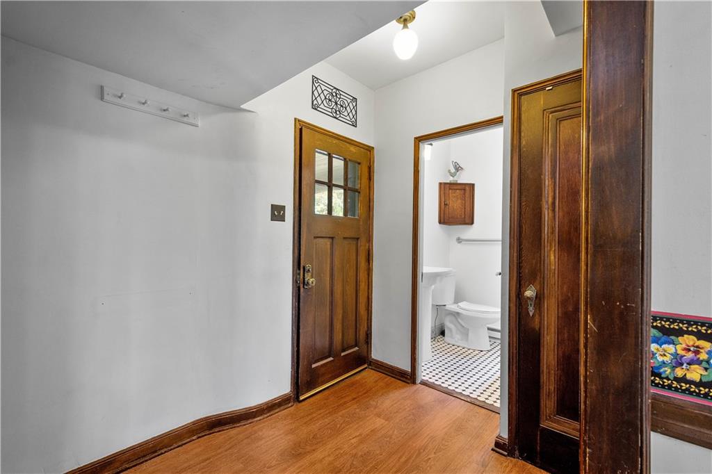 2 Crescent Drive Pittsburgh, PA 15228 - Photo 17 of 48 a view of a hallway with wooden floor and a bathroom